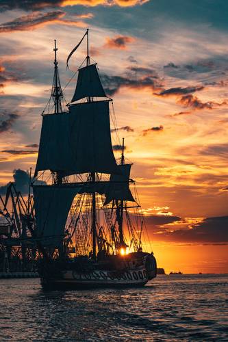 The Frigate Shtandar in calm weather sailing sunset time Riga Latvia