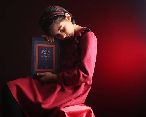 Portrait of a little girl with Hafez's book