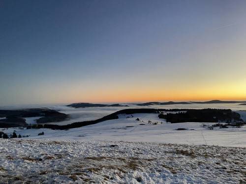 sunset on top of winter mountain Rhoen Rhön Hesse Germany