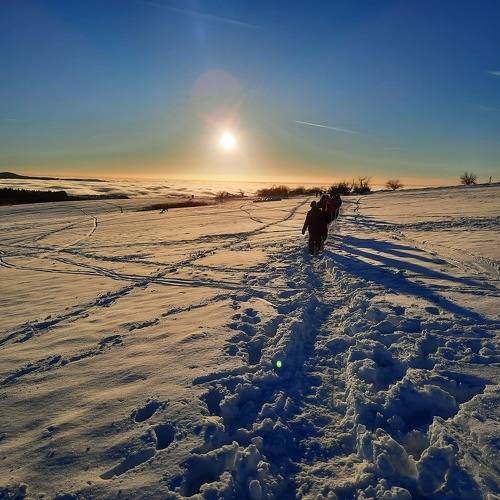 sunset in the snow on top of winter mountain Rhoen Rhön Hesse Germany