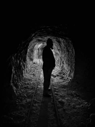 Silhouette man in the cave