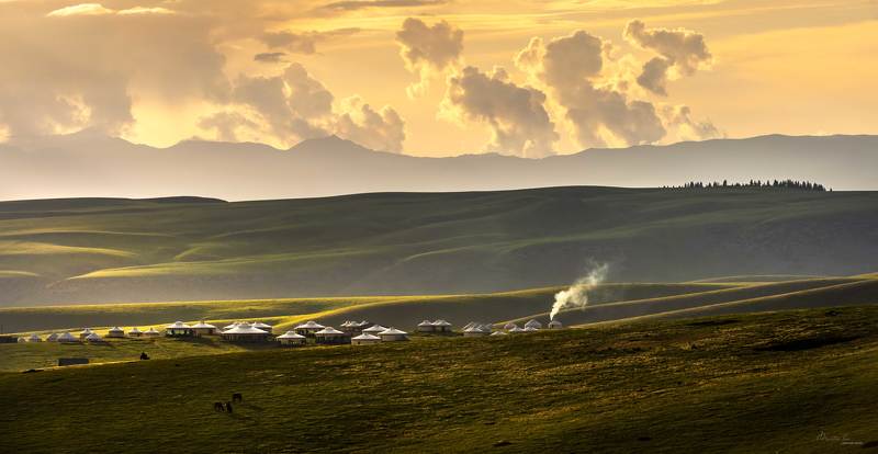 Smoke is curling upward from kitchen chimneys фото превью