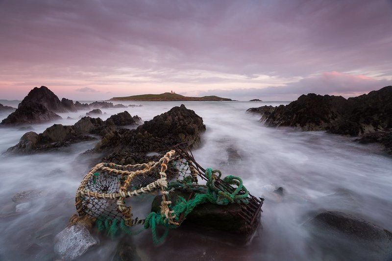Crab trap at lighthouse background фото превью