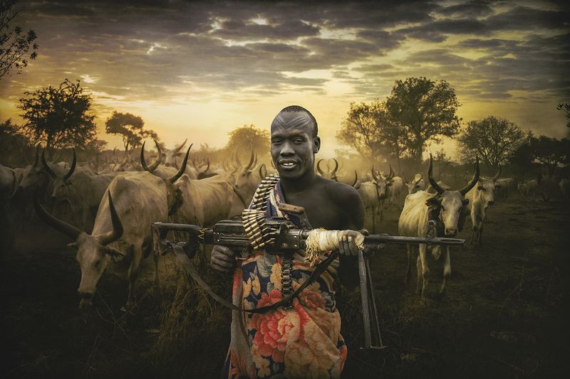 child,people,children,kids,boy,kid,africa,person,people,urban,woman,light,low key,low-key,girl,dark,fog,shadow,mundari,dinka,southsudan,sudan,tribal,tribe,africa,afrika,horns,sunset,sunrise,war,cattle,animal,nature,horn,wild,horned,cow,rural,south_sudan,c An armed man of the Mundari tribe фото превью
