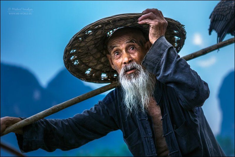 Портрет китайского рыбака фото превью