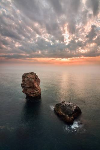 Sunrise in the misty sea