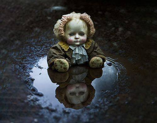 a doll thrown to the ground - unnecessary