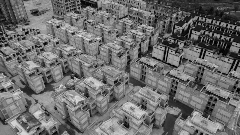 new, neighbourhood, compound, unfinished, frozen, postponed, delayed, closed, blocked, windows, anti occupation, grey, cement, concrete, small, buildings, aerial, view, bird\'s eye Ghost city. фото превью