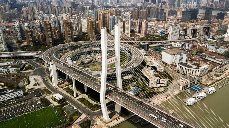 nan pu bridge, shanghai bridge, huangpu river, cityscape view, circular highway, urban architecture, skyline panorama, daytime bridge scene, tall buildings backdrop, bird\'s eye view, city transportation, bridge with cars, iconic shanghai landmark, urban i Spanning Horizons: Nan Pu Bridge and the Thriving Metropolis of Shanghai фото превью