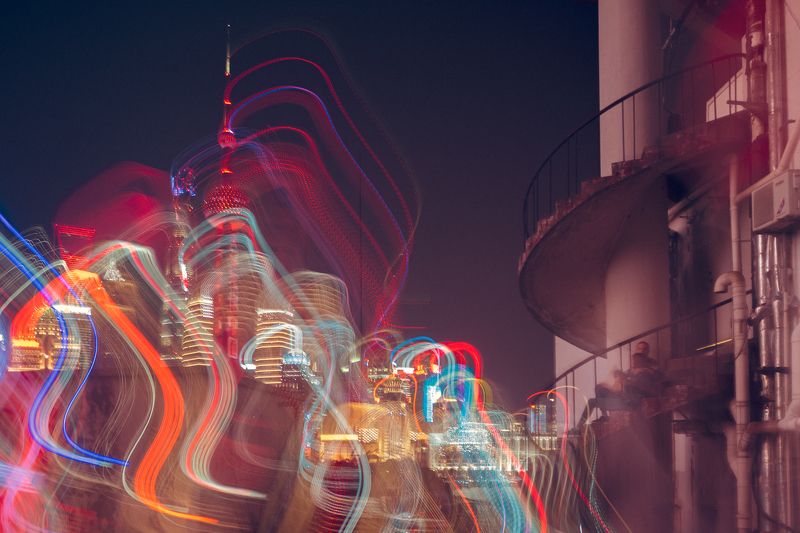 city lights, vibrant buildings, light trails, colorful palette, spiral staircase, hotel emergency exit, light show, metropolis skyline, urban night scene, couple watching lights, cityscape photography, night skyline view, urban trails of light, colorful u Urban Luminous Romance фото превью