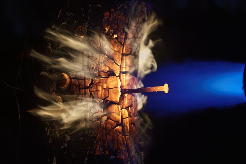 fire closeup, burning wood, fiery tree trunk, intense flames, cracked wood, glowing orange, hot wood texture, rocket-like fire, powerful blaze, resilient wood, molten iron nail, heat resistance, blue fire light, enchanting flames, magical fire beauty. Wood\'s Dance with Flames фото превью