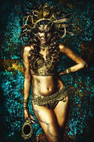 Her ringlets curl like snakes And her gaze is stony cold