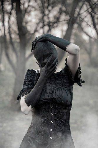 Behind the left shoulder