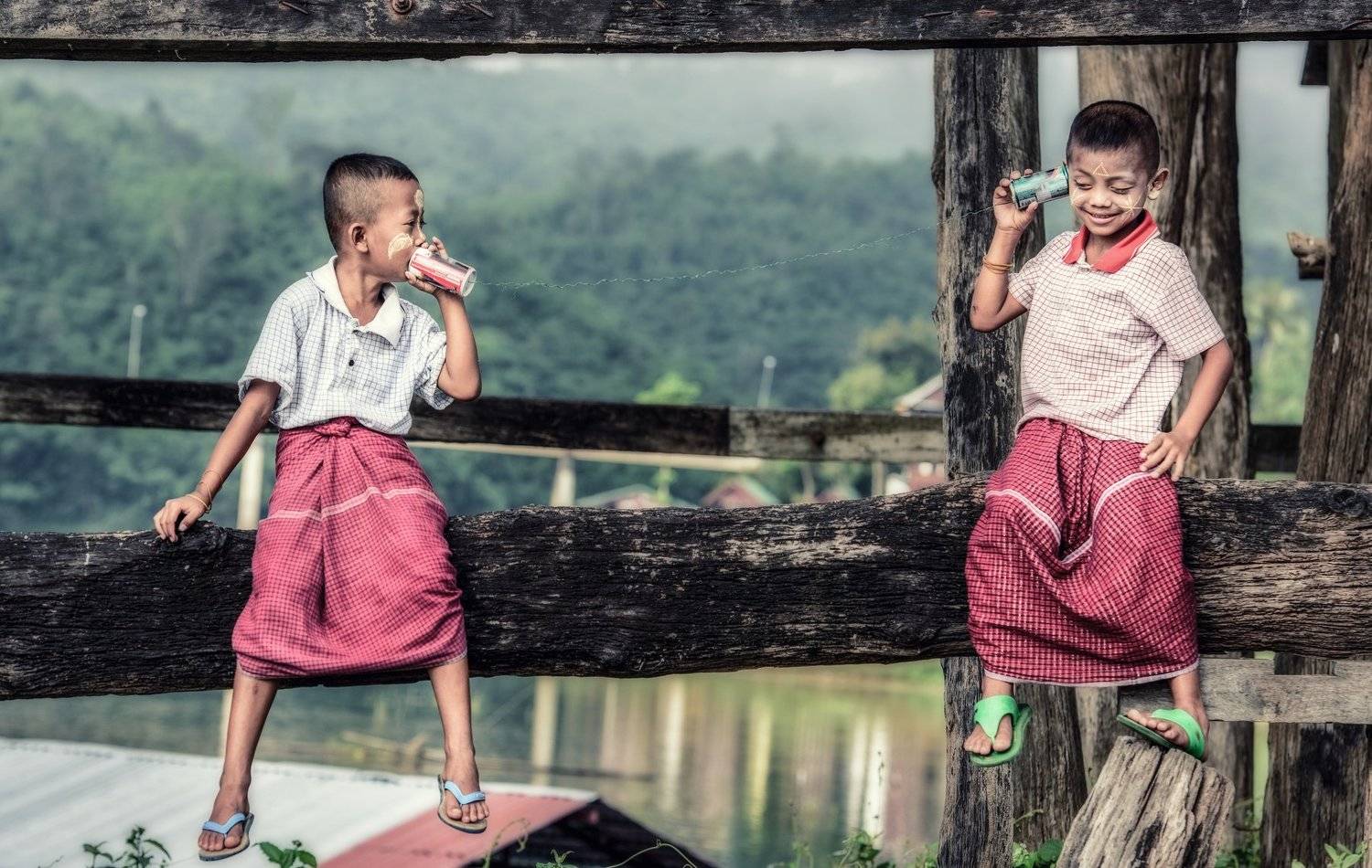 can; kid; tin; phone; child; string; two; toy; young; discussion; clothing; fun; listen; boy; day; horizontal; telephone; discovery; casual; people; technology; childhood; talk; metal; leisure; activity; white; friendship; portrait; cute; smile; connectio, Sasin Tipchai