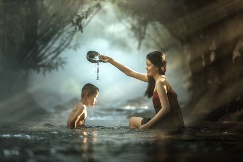 Sister and brother bathing