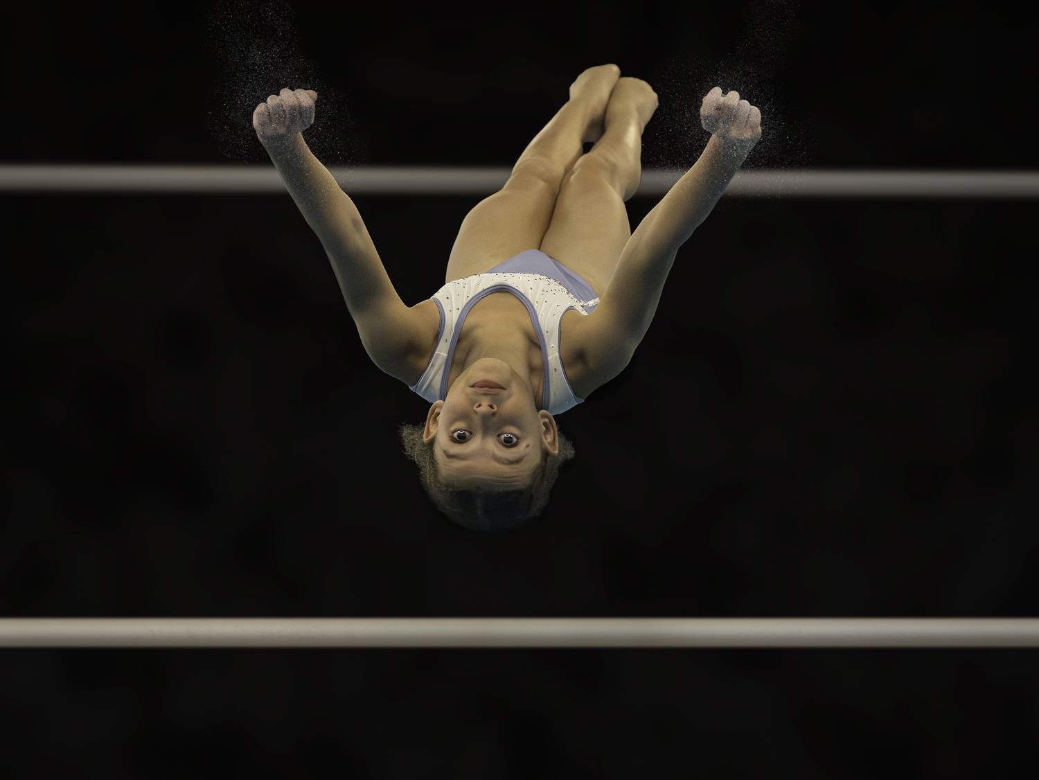 Airborne elegance on uneven bars. Автор: Eddie Leach , Eddie Leach