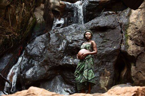 Baby Bump maternity pregnancy outdoors on location waterfalls Karura Forest urban Nairobi City County Kenya East
