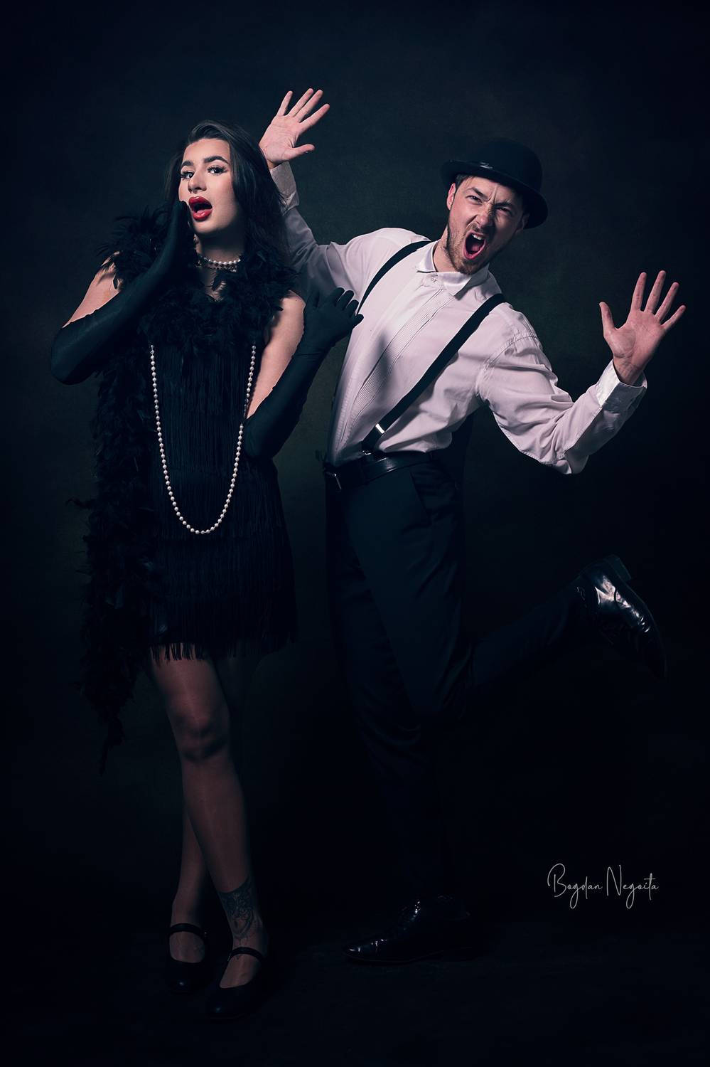 vintage, retro, theatrical, cabaret, studio portrait, expressive, 1920s, black outfit, dramatic pose, flapper style, pearls, suspenders, bowler hat, character photography, humor, performance, cinematic, glamour, classic style, dance pose, Bogdan Negoita