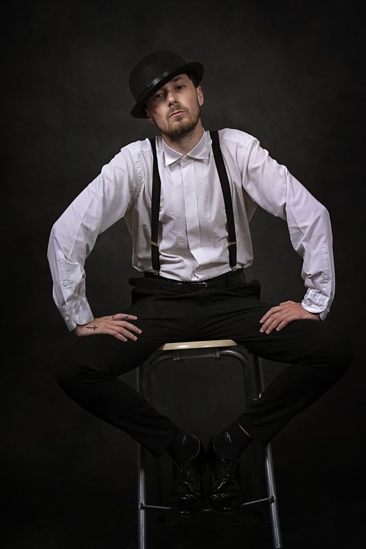 portrait, man, hat, suspenders, vintage style, theatrical, moody lighting, retro fashion, expression, character study          ask chatgpt Attitude in Silence фото превью