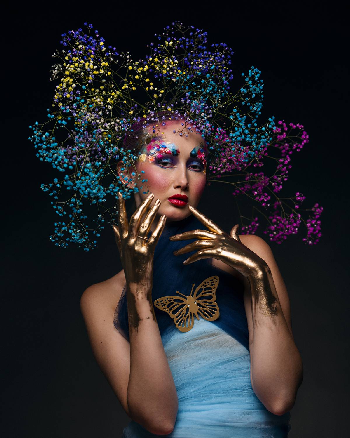 abstract fantasy, avant garde, body paint, bold makeup, color burst, conceptual beauty, fantasy styling, fine art, floral headpiece, golden accents, intense palette, metallic paint, modern surrealism, poetic vision, visual impact, vivid expression, Alex Tsarfin
