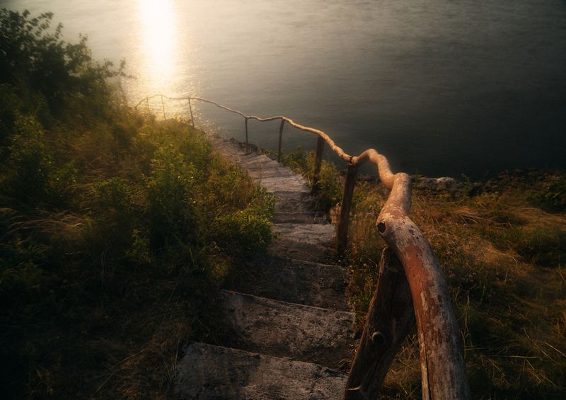 landscape, golden hour, leading lines, handrail, steps, coastline, minimal, cinematic, moody landscape, nature, water, evening, texture, filmic, solitude, path, stairs, wood, reflection, outdoor Лестница к золотой тишине фото превью