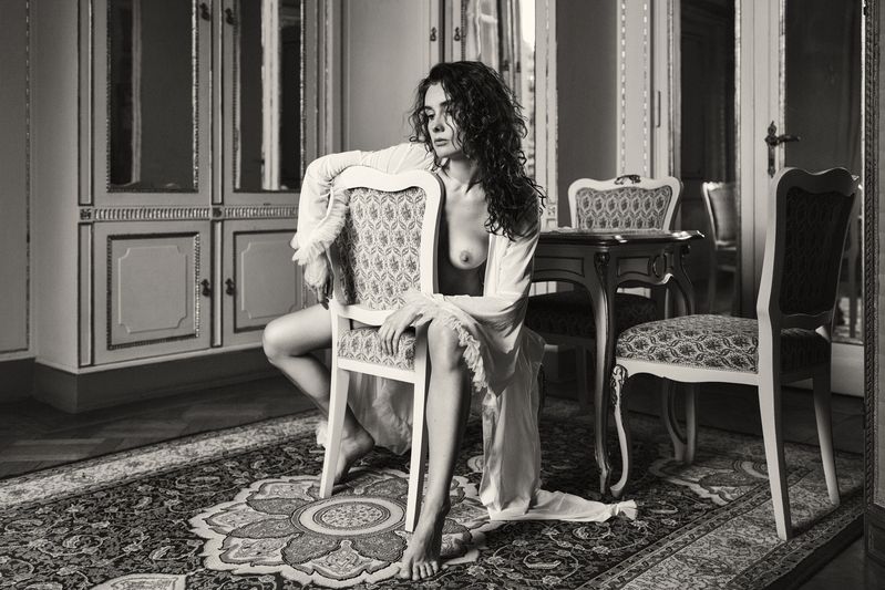 antique interior, artistic nude, chair pose, curly hair, emotional depth, fine art, gilded mirrors, intimate atmosphere, monochrome style, nostalgic tone, ornate furniture, poetic sensuality, romantic nude, sensual silence, vintage aesthetic, woman form Portrait of Longing фото превью