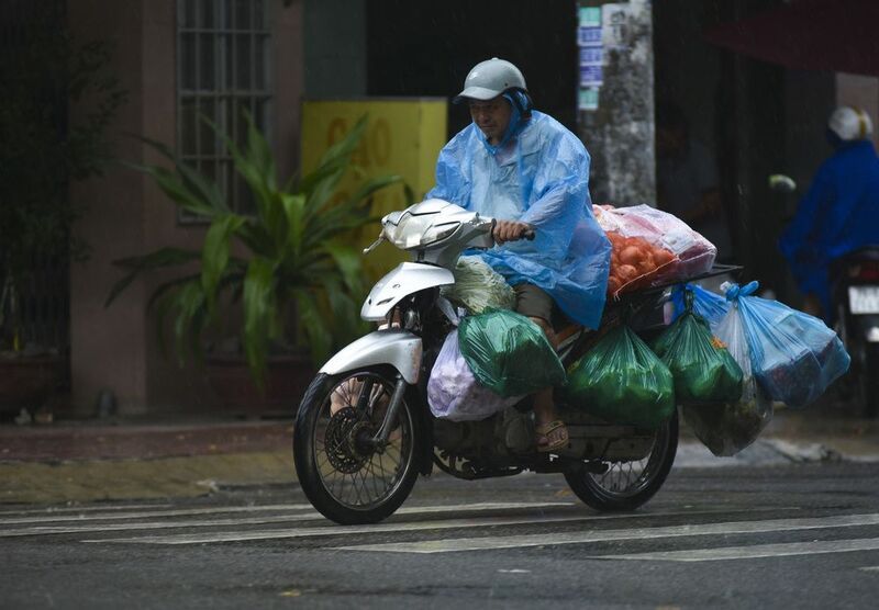 Raincoat on the VietNam streets фото превью