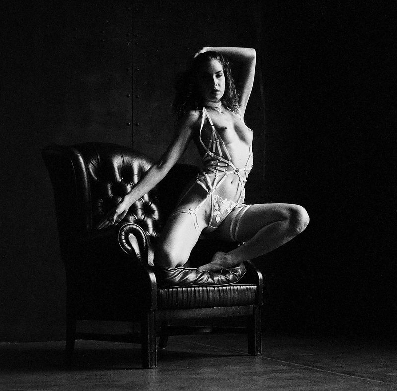 portrait, blackandwhite, monochrome, studio, vintage, film, analog, fashion, dramatic, contrast, lighting, shadow, figure, chair, pose Between Shadow and Silk, a Quiet Pose фото превью