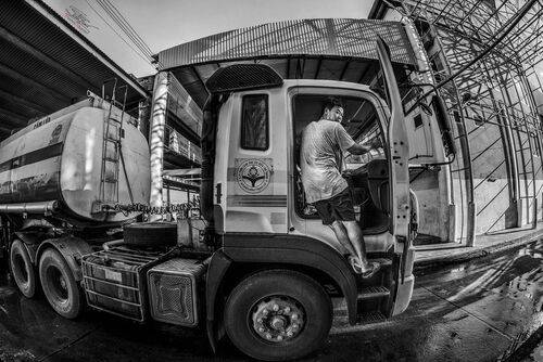 One of the busy people at the fishing port.