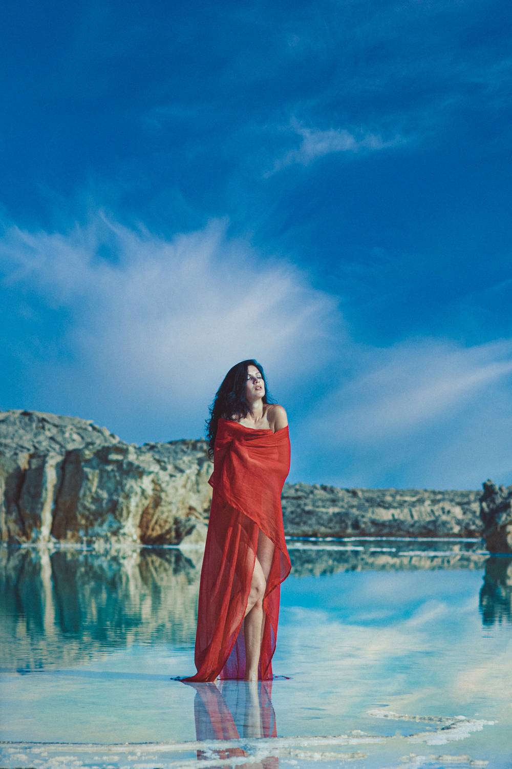 portrait, woman, red, dress, fabric, fashion, editorial, water, reflection, sea, ocean, sky, clouds, blue, cyan, Rozman Erik