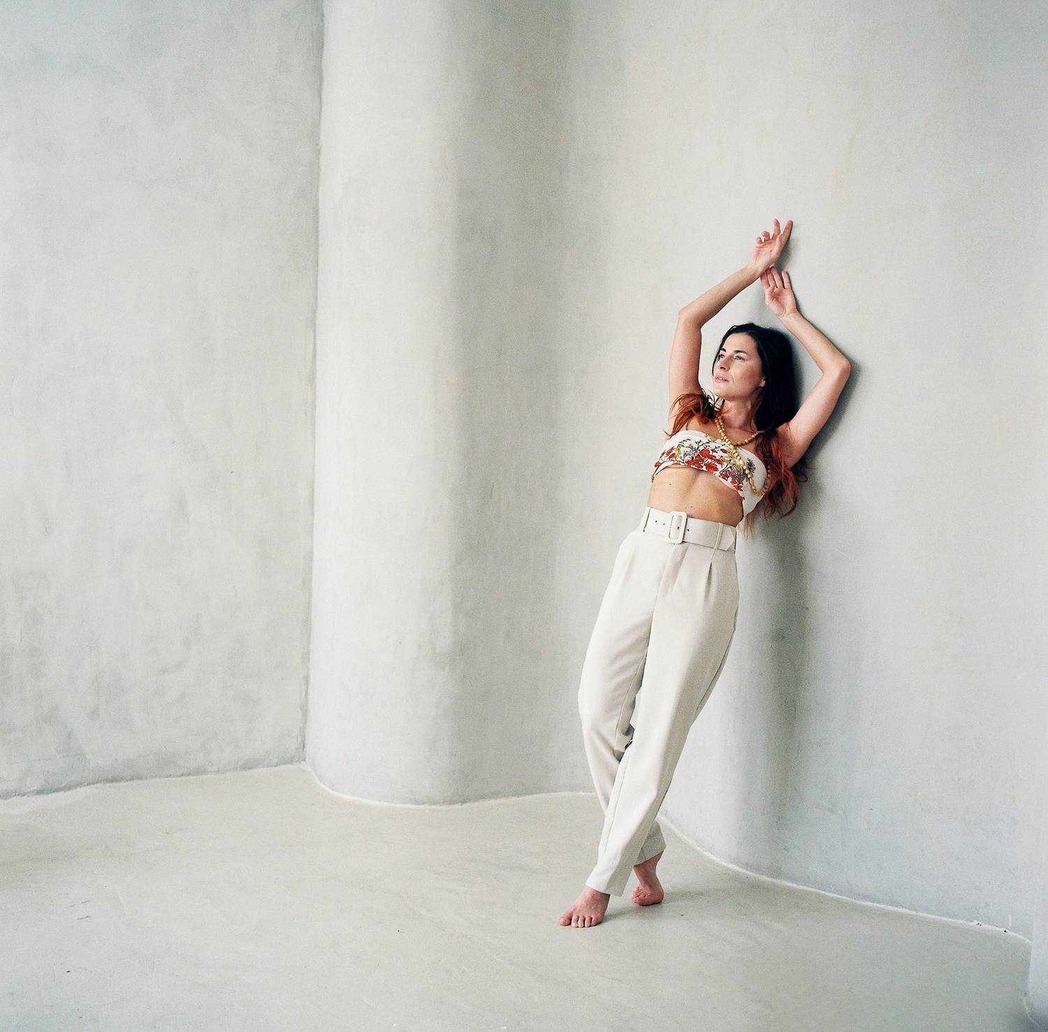 portrait, woman, editorial, fashion, film, analog, medium, format, minimal, minimalism, white, wall, corner, barefoot, trousers, Rozman Erik