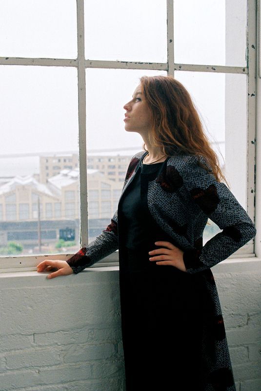portrait, woman, window, light, natural, urban, city, gaze, profile, redhead, fashion, jacket, loft, industrial, contemplation Where the City Meets Her Silence (KH. 41) фото превью