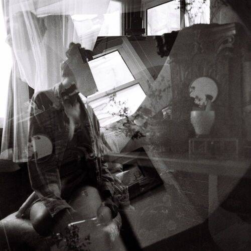Ghosts Between the Glass and Memory (Dana B. 23)