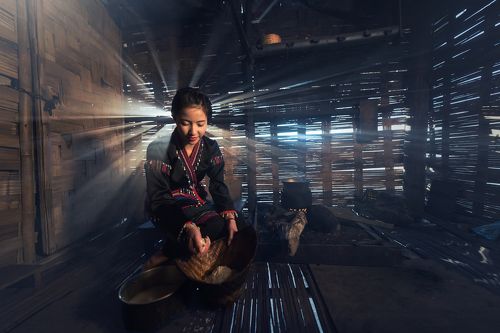 Asian womon cooking at house