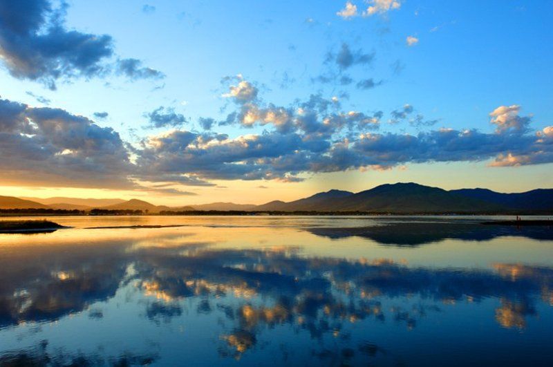 солнце., закат., облака. небо. отражение. Закат на Славянке фото превью