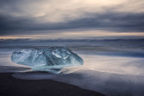 Big stopper exercise with ice mushroom. (Breidamerkursandur, Iceland)