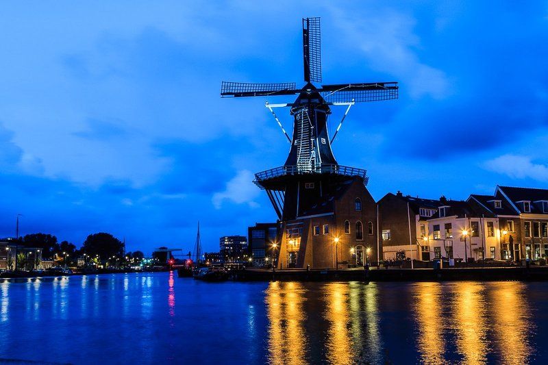 windmill,city,river,water,sky,clouds,lights,night,evening,cityscape Haarlem фото превью