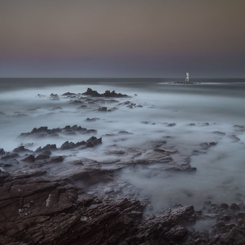sunrise,sardinia,lighthouse,nikon D850,zeiss 21distagon,travel,log exposure,rocks,sea,sky, behind surise фото превью