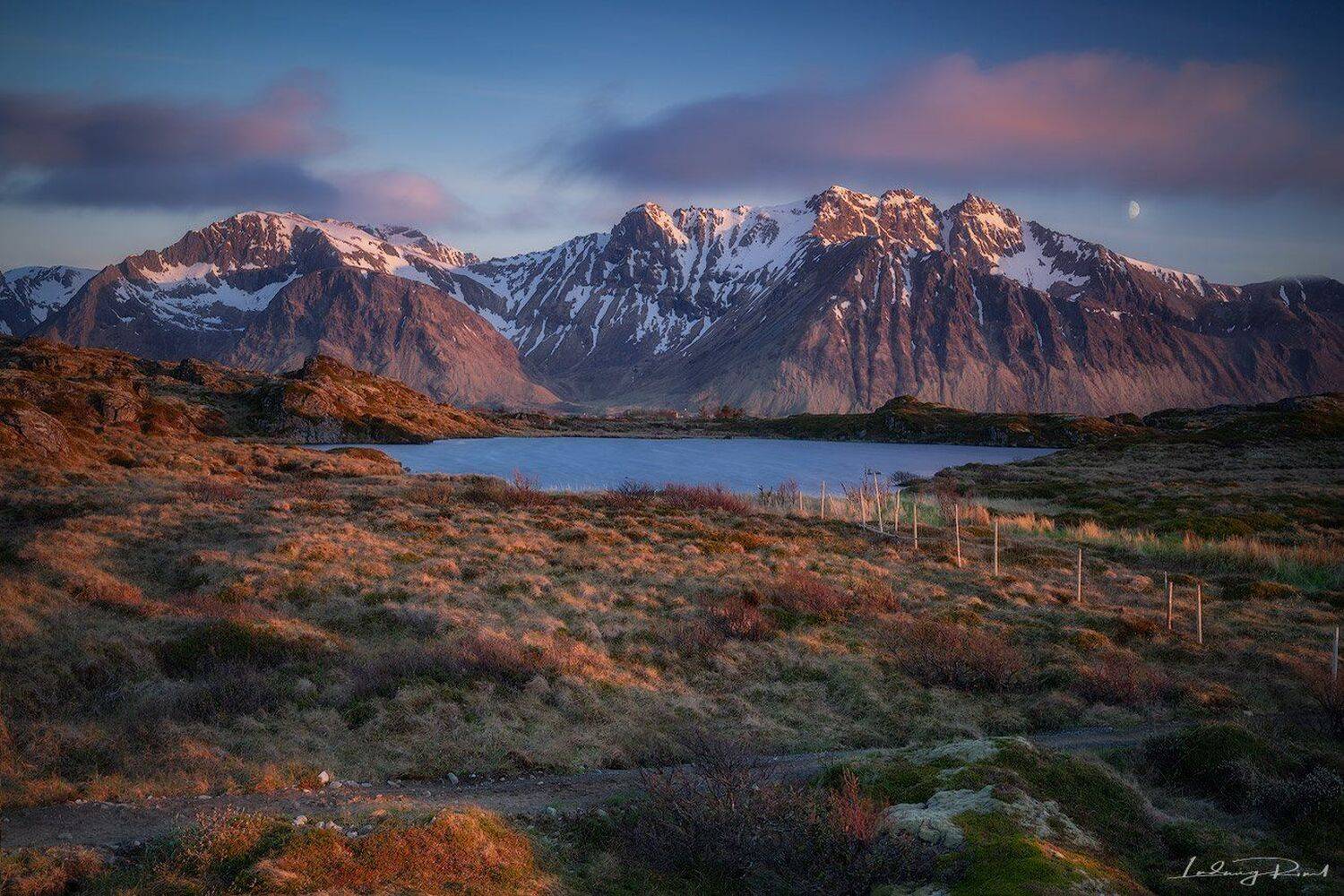 blue, bushes, clouds, dawn, evening, evening glow, fence, golden hour, gorge, grass, gravel road, hills, lake, landscape, lofoten, lofoten islands, midnight sun, moon, mountain range, mountains, nordic light, nordland, norway, outdoors, path, pink, ravine, Ludwig Riml