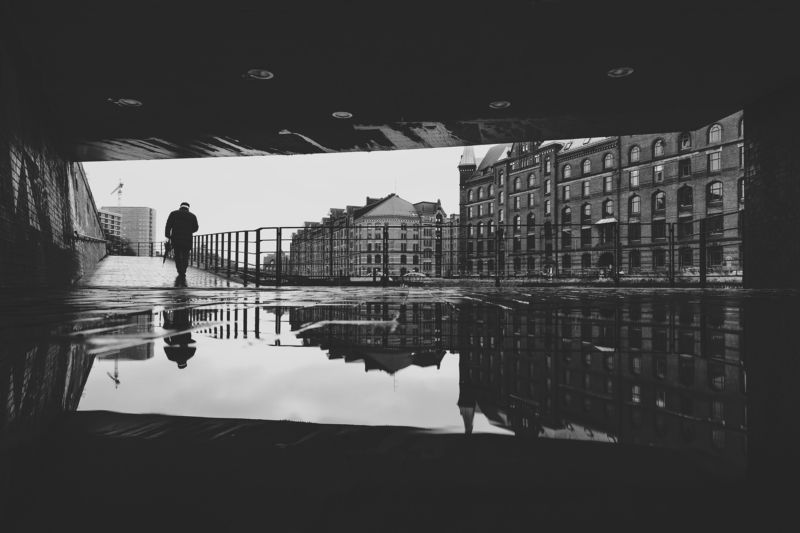 bridge man people street urban rain reflecion puddle umbrella on cold and rainy sunday фото превью