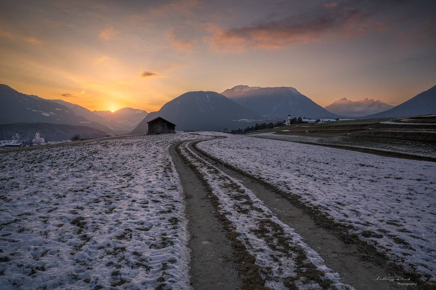 acres, agicutural building, agriculture, alps, austria, austrian alps, bend, bending road, church, clouds, evening, evening glow, farmhouse, fog, foggy, forest, gravel road, hey barn, hill, hills, houses, landscape, meadows, meandered, meandered road, mie, Ludwig Riml