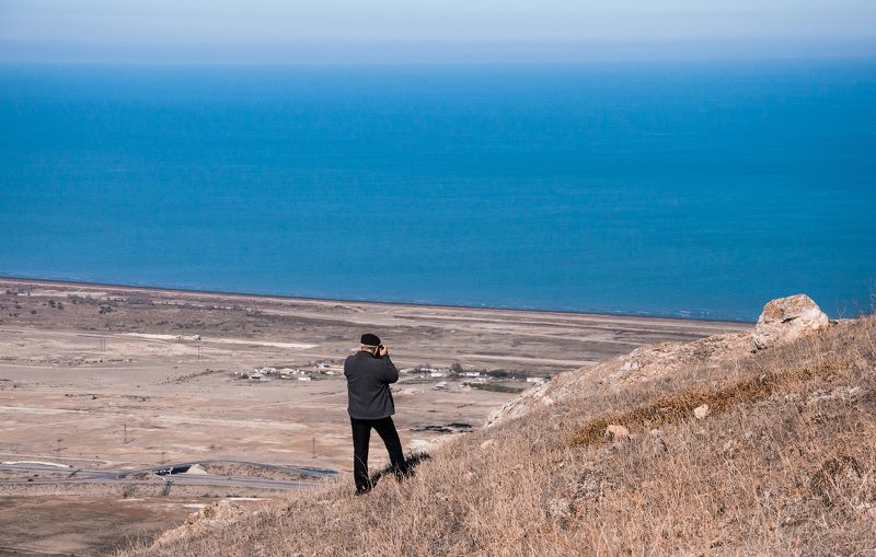 Фотограф и море фото превью