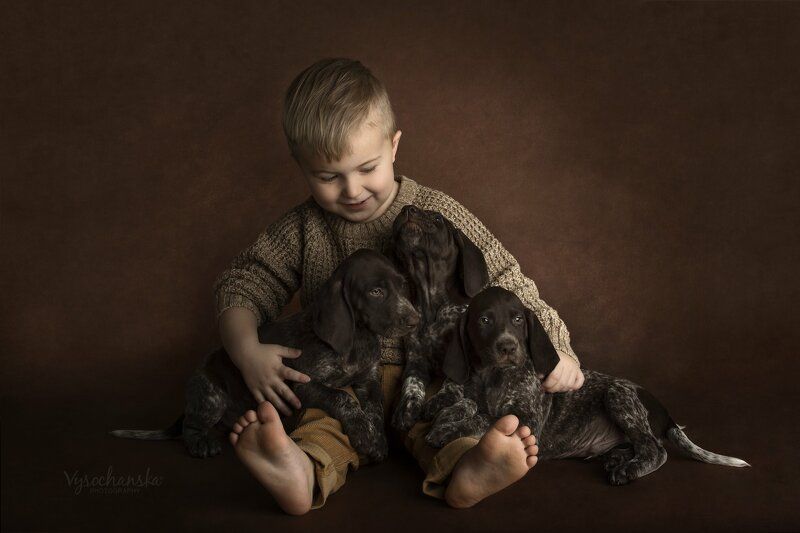 boy with puppies