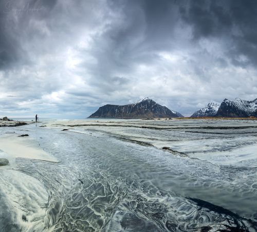 Lonely photographer at Skagen beach. Lofotens.