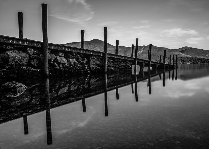 water reflection monochrome england lake mountains sky stones rocks rock stone uk blackandwhite white black contrast photography sky clouds relaxing Jetty reflection фото превью