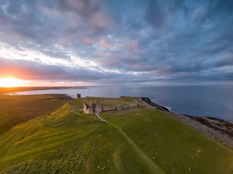 Northumberland, coastline, North Sea, UK, sunset View from the air to Embleton bay, North sea.  фото превью