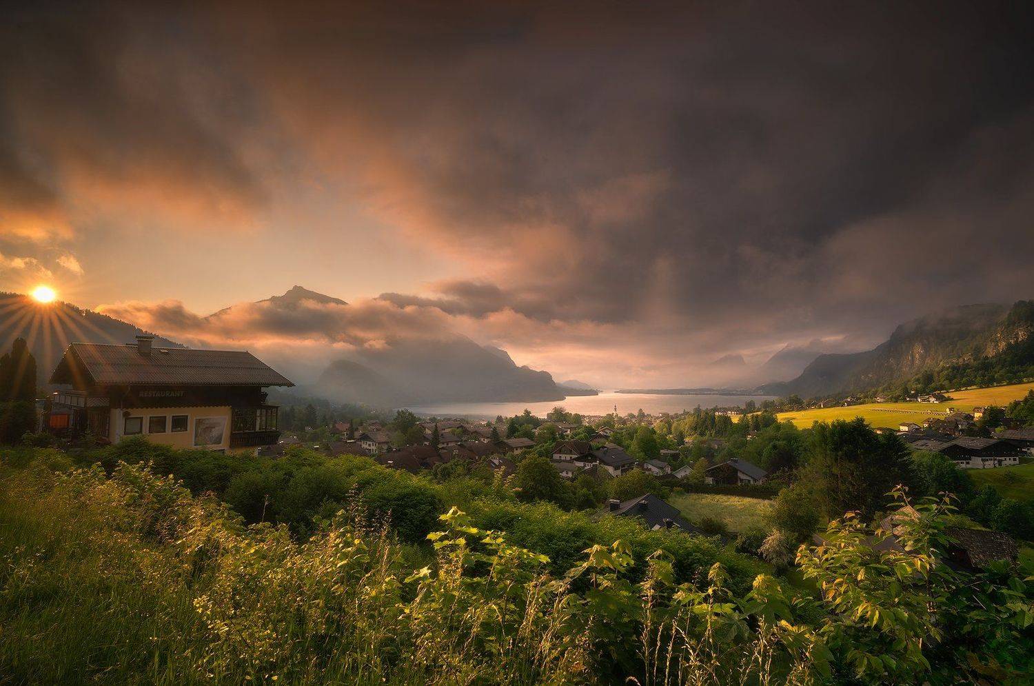Austria, Bushes, church, Church Tower, Cliffs, Clouds, cloudy, fog, foggy, Grass, Hills, lake, Lake Wolfgang, morning, Morning Mist, Morning Mood, Mountain Range, mountains, outdoors, Salzburg, Salzkammergut, St. Gilgen, Sun, Sun beams, Sun lit, Sun rays,, Ludwig Riml
