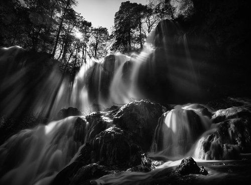 Rays of light over Panda Lake waterfall