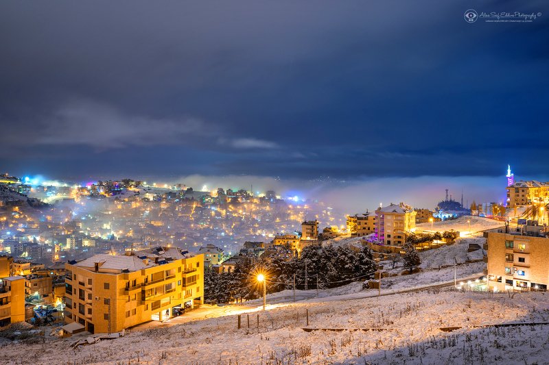 My home town covered by snow and fog фото превью