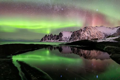 Aurora borealis over Ersfjord beach. Senya Island at night, Norway